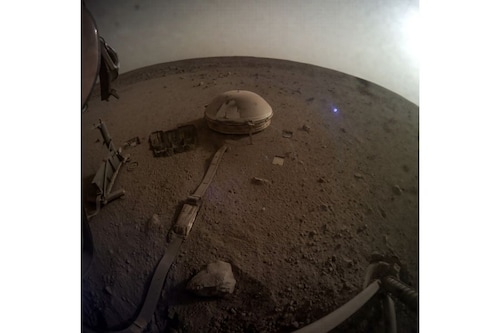A photo provided by NASA and JPL-Caltech shows the area in front of the InSight Mars lander on Monday, May 16, 2022. The stationary robotic probe on Mars has been steadily growing weaker as dust accumulates on its solar panels. Image: NASA/JPL-Caltech via The New York Times A photo provided by NASA and JPL-Caltech shows the area in front of the InSight Mars lander on Monday, May 16, 2022. The stationary robotic probe on Mars has been steadily growing weaker as dust accumulates on its solar panels. Image: NASA/JPL-Caltech via The New York Times