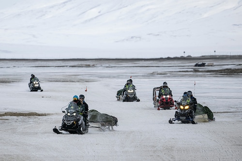 Tourists come back to Longyearbyen after a tour on snow mobiles, on May 8, 2022, on Spitsbergen island, in Svalbard Archipelago, northern Norway.â€‹ Image: Jonathan NACKSTRAND / AFP
