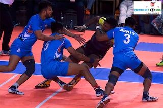 India"s players tussle with Sri Lanka"s Y.D. Sanjaya (C) during the Kabaddi final at the 13th South Asian Games (SAG) in Kathmandu on December 9, 2019. Image: PRAKASH MATHEMA/AFP via Getty Images