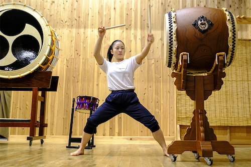Japanese taiko drum performer Hana Ogawa of the Kodo troupe warming up before a performance on Sado island. (Credits: Charly TRIBALLEAU / AFP)