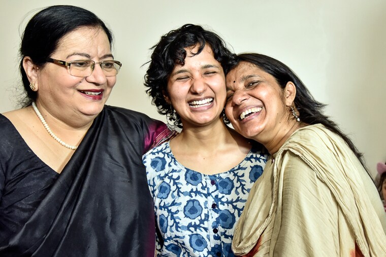 UPSC Civil Services exam topper Shruti Sharma with her mother Rachna (right) and Jamia Millia Islamia Vice Chancellor Najma Akhtar (left) at their East Of Kailash residence, New Delhi, May 30, 2022. Shruti prepared for the exams at the free Residential Coaching Academy (RCA) at Jamia Millia. Women aced the top three ranks in the exams, with 177 women among the 685 successful candidates recommended to various services.