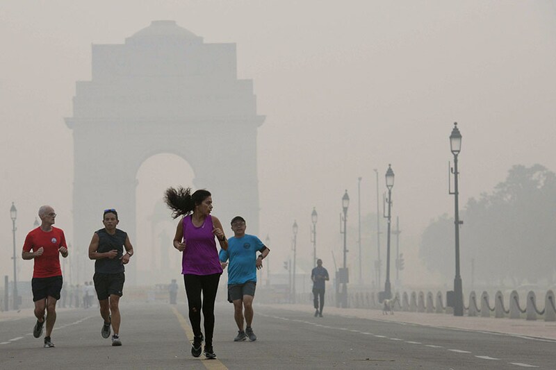 Joggers at India Gate on a smog-engulfed morning on November 1, 2022, in New Delhi, India. The toxic air quality in Delhi plunged into the "severe" category on Tuesday as the overall Air Quality Index (AQI) of the city touched 424, caused by pollutants from local sources and farm fires in neighbouring states, as per data released by Centre"s air-quality monitoring body SAFAR.