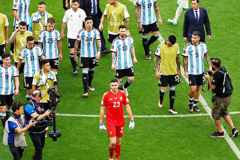 Lionel Messi of Argentina and his teammates walk off as a group after the 1-2 defeat during the FIFA World Cup Qatar 2022 Group C match between Argentina and Saudi Arabia at Lusail Stadium on November 22, 2022, in Lusail City, Qatar.