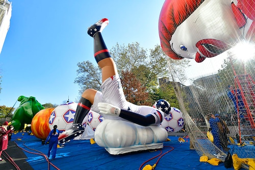 Ahead of the 96th Macy"s Thanksgiving Day Parade, the crew works on inflating the balloons of Striker the US Soccer Star by Fox Sports and Ronald McDonald by McDonald"s on November 23, 2022, in New York City.