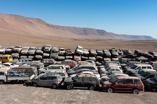 Mountains of discarded clothing, a graveyard of shoes, and rows upon rows of scrapped tires and cars blight at least three regions of the desert in northern Chile. Image: Photography MARTIN BERNETTI / AFP