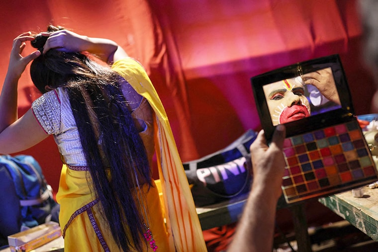 Ramleela actors get ready before a performance during Navratri festival celebrations, in New Delhi, India, on October 3, 2022.