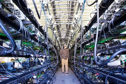 The business model of crypto miners who used vast power-guzzling computer rigs to compete with each other to solve complex equations, and win the prize of adding entries to the blockchain and generate coins was wiped out overnight by the Ethereum software upgrade called the "Merge". Image:&nbspNatalie Behring/Getty Images