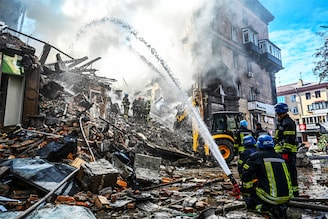 Rescuers work at the site of a residential building heavily damaged by a Russian missile strike, amid their attack on Ukraine, in Zaporizhzhia, Ukraine October 6, 2022.