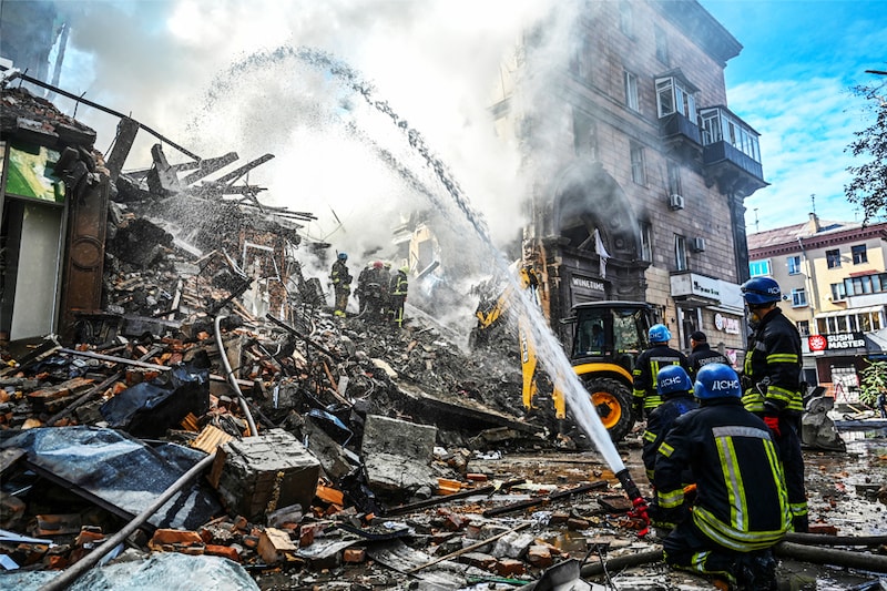 Rescuers work at the site of a residential building heavily damaged by a Russian missile strike, amid their attack on Ukraine, in Zaporizhzhia, Ukraine October 6, 2022.