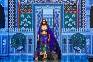 Bollywood actress Malaika Arora presents a creation by designer Limerick during the FDCI X Lakme Fashion Week in Mumbai on October 14, 2022.