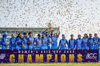 India’s cricketers celebrate their victory at the end of the women"s Asia Cup final cricket match between India and Sri Lanka at Sylhet International Stadium in Bangladesh on October 15, 2022. India maintained their dominance with an eight-wicket demolition of Sri Lanka, to romp to their seventh Asia Cup title. Image: Tanvin Tamin / AFP
