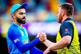 Australia"s captain Aaron Finch (R) shakes hands with India"s Virat Kohli after the ICC 2022 Twenty20 World Cup cricket warm-up match between Australia and India at the Gabba in Brisbane on October 17, 2022. India won the match by 6 runs.