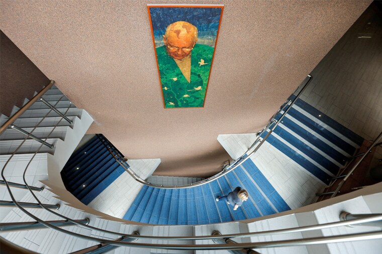 A woman walks upstairs as journalists visit the office of the Gorbachev Foundation following the death of the final leader of the Soviet Union Mikhail Gorbachev in Moscow, Russia, on August 31, 2022.