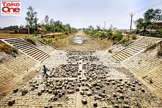 A file photo of a dried canal in late May in Badokhar village on the outskirts of Allahabad, Uttar Pradesh. A severe heatwave in May had caused drought-like conditions in vast swathes of India"s agricultural heartland as the rains that usually arrive before the country"s prolonged monsoon season had failed. India is particularly vulnerable to drought as its under-developed agriculture sector is heavily dependent on timely, uninterrupted natural weather cycles for its survival.
Image: Ritesh Shukla/Getty Images