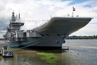 Indian Navy officers stand on the flight deck of India"s first home-built aircraft carrier INS Vikrant after its commissioning ceremony at a state-run shipyard in Kochi, India, September 2, 2022.