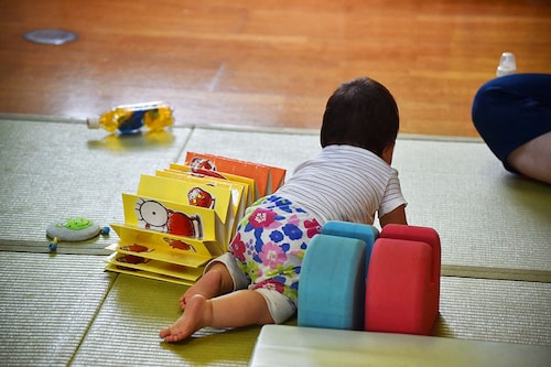 A nursing home in southern Japan is "hiring" babies for a very important job — to keep its elderly residents company and make them smile. Image: Kazuhiro Nogi/AFP  A nursing home in southern Japan is "hiring" babies for a very important job — to keep its elderly residents company and make them smile. Image: Kazuhiro Nogi/AFP 