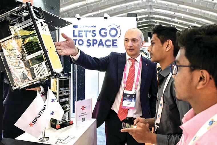 Local visitors listen to a representative of the Russian Space Agency "Roscosmos" at a stall on the inaugural day of the 7th edition of the Bengaluru Space Expo 2022 at the Bengaluru International Exhibition Center in Bengaluru on September 5, 2022. As the main successor to the Soviet space program, Roscosmos" legacy includes the world"s first satellite, first human spaceflight, and Salyut, the first space station. It is also a major partner in the International Space Station.