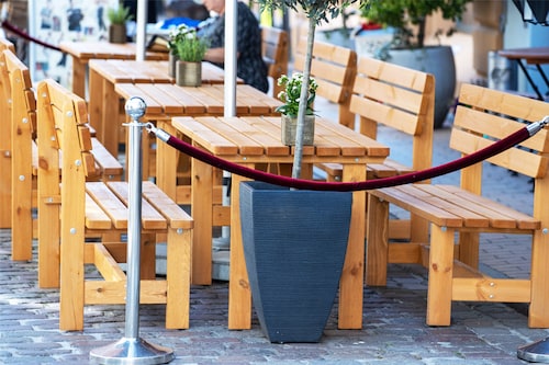 Empty tables in front of a restaurant in the old town of Schwerin, Germany. The shortage of skilled workers in the restaurant and catering industry has caused severe losses during the peak tourism season.&nbspImage: Jens BÃ¼ttner/picture alliance via Getty Images