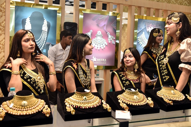 Models display jewellery at the The Delhi Jewellery & Gem Fair (DJGF) at Pragati Maidan, on September 10, 2022 in New Delhi, India. The 10th edition of North India"s biggest International jewellery trade show provides a platform for sellers to connect, exchange ideas, discover upcoming trends and generate business opportunities with buyers all across the country.