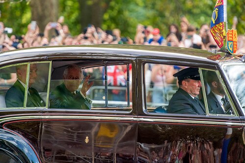 King Charles III waves as he is driven to Buckingham Palace in London on Sunday, Sept. 11, 2022. Charles spent years turning his royal estate into a billion-dollar portfolio. (James Hill/The New York Times)