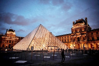 French Culture Minister Rima Abdul Malak said on Saturday, the Louvre Pyramid would going dark at 11:00 pm instead of 1:00 am
Image: Stephene De Sakutin / AFP