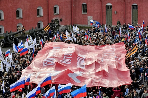 People attend a rally and a concert in support of the controversial annexation referendums in Russian-held regions of Ukraine, in Saint Petersburg, Russia on September 23, 2022. Voting on whether Russia should annex Kremlin-controlled regions of Ukraine opened Friday. Western nations denounced the referendum that has dramatically raised the stakes of Moscow"s seven-month invasion of Ukraine.
