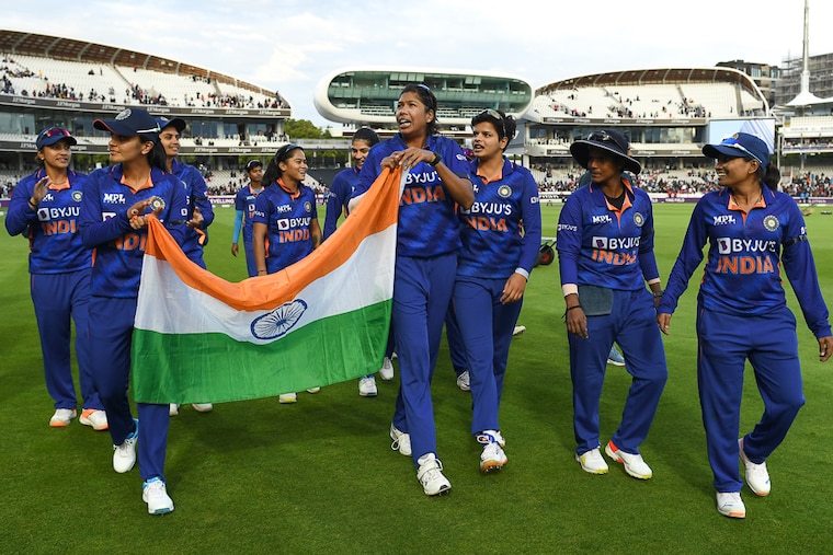 Legendary pacer Jhulan Goswami (centre) holds a flag during a lap of honour after India won the final One Day International against England, sweeping the 3 match series, at Lord"s Cricket Ground on September 24, 2022 in London, England. Picking up a wicket with the 10,001st ball of her career, 39 year old Goswami signed off her glorious career as cricket"s highest wicket taker.