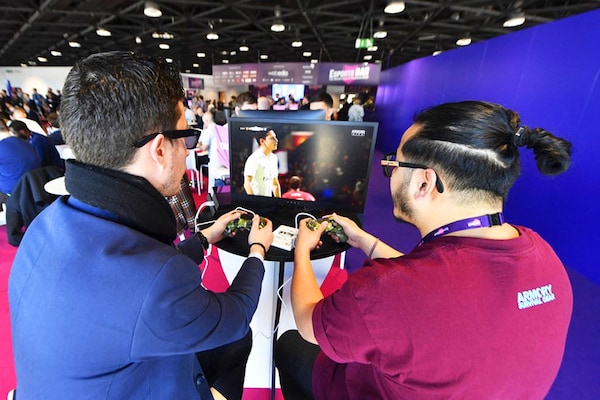 This file photograph shows visitors playing on EA Vancouver video game developer"s football simulation video game FIFA 19 at the eSports Bar trade fair in Cannes, southern France on February 13, 2019. The 2023 edition of Fifa, the leader of soccer simulation video games, will be out on September 30, 2022, as it is developed each year by the US game maker Electronic Arts since 1993. Image:&nbspYANN COATSALIOU / AFP