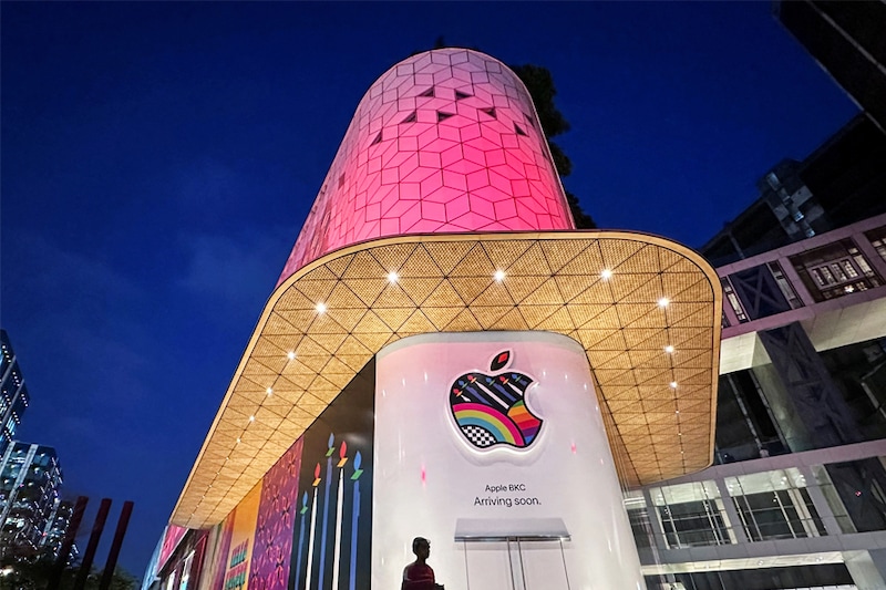 A man walks past the barricade of India"s first Apple retail store, which will be launched soon, at Jio World Drive Mall, Mumbai, India, on April 5, 2023.