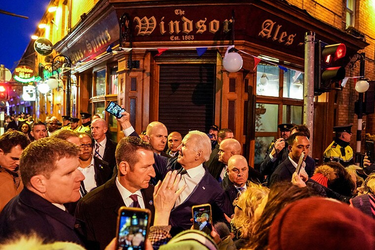 US President Joe Biden takes a selfie outside a pub during his visit to Dundalk, Ireland, April 12, 2023. President Biden is on a four-day trip to Northern Ireland and Ireland.