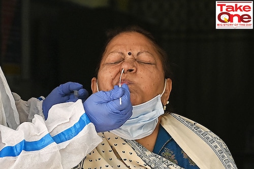 A healthcare worker collects a swab sample of a woman for Covid-19 test, amid a rise in coronavirus cases in India, in New Delhi on April 17, 2023. Image: Arrush Chopra/NurPhoto via Getty Images