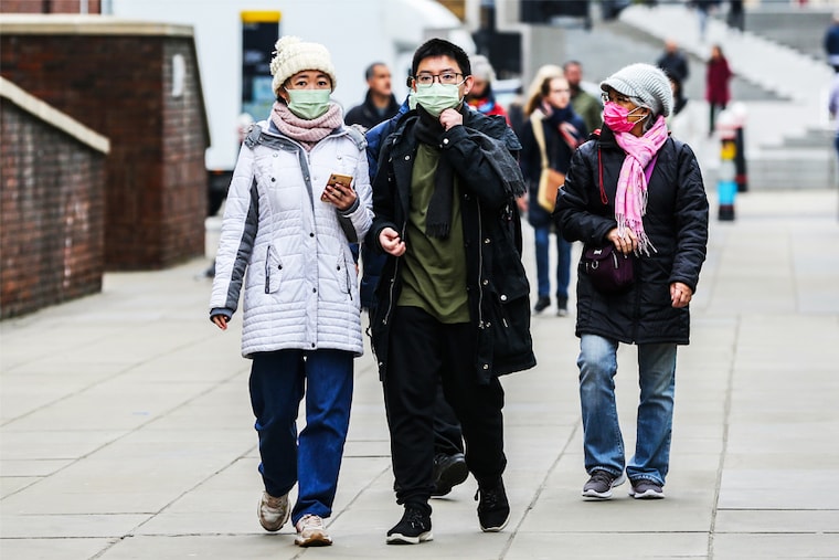 A family is seen wearing face masks in central London. A new Covid-19 strain which has increased infections in India has sparked fears it could also lead to a rise in cases in the UK.