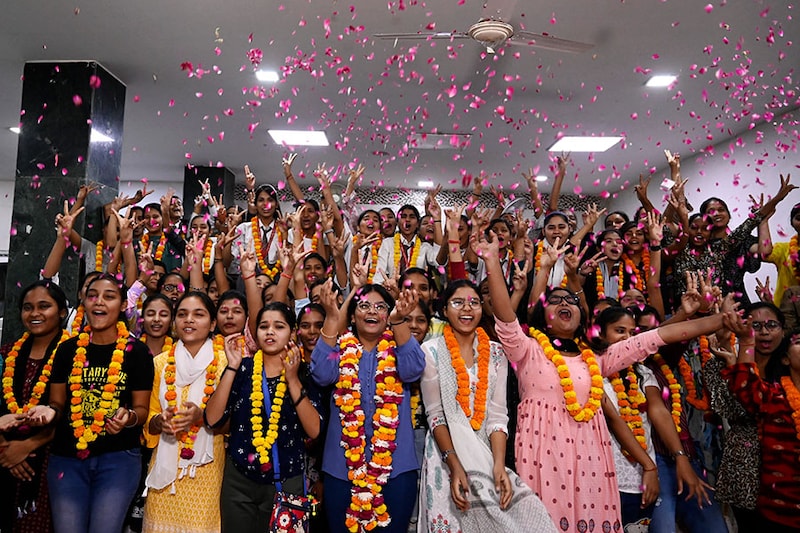 Students of class 10th and 12th celebrating their success in the Uttar Pradesh Board exam result, on April 25, 2023, in Lucknow, India. To evaluate 3.19 crore answer sheets, the UP board set up 1,43,933 examiners in 258 centres, and announced the results of 10th and 12th grades in just 67 days, a new record.