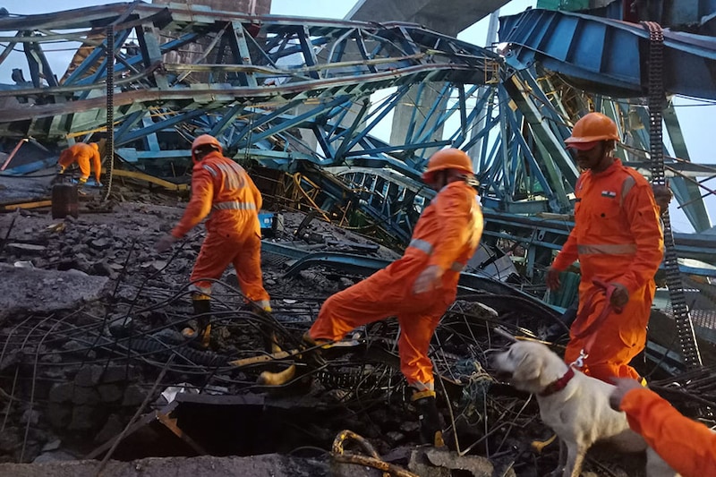 NDRF personnel during a search and rescue operation following an incident that happened on under construction Samruddhi Expressway. A crane fell on the slab of the bridge, in Shahapur, Thane, on Tuesday, August 1, 2023. Until now, at least 14 dead bodies have been retrieved. Three people have been injured, and another six are feared to be trapped inside the collapsed structure.