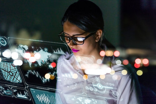 A woman wearing glasses looks at code on a computer screen.
Image: Shutterstock A woman wearing glasses looks at code on a computer screen.
Image: Shutterstock