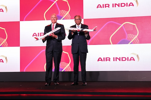 Campbell Wilson, CEO and MD, Air India, and N Chandrasekaran, chairman, Tata Group unveil the new livery of the airline at the brand relaunch event. Image: Air India Campbell Wilson, CEO and MD, Air India, and N Chandrasekaran, chairman, Tata Group unveil the new livery of the airline at the brand relaunch event. Image: Air India