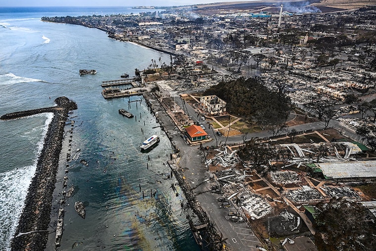 An aerial image taken on August 10, 2023, shows destroyed homes and buildings burned to the ground in historic Lahaina in the aftermath of wildfires in western Maui in Lahaina, Hawaii. At least 36 people have died after a fast-moving wildfire turned Lahaina to ashes, officials said on August 9, 2023. Visitors who were asked to leave the island of Maui found themselves stranded at the airport. The fires began burning early August 8, scorching thousands of acres and putting homes, businesses and 35,000 lives at risk on Maui, the Hawaii Emergency Management Agency said in a statement.