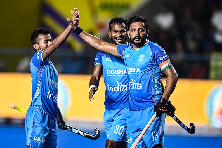 India"s Harmanpreet Singh (R) celebrates after scoring a goal during the Asian Champions Trophy 2023 hockey tournament semi-final match between India and Japan at the Mayor Radhakrishnan Stadium in Chennai on August 11, 2023. India dominated in the match to win it by 5-0 to enter the Asia Champions Trophy Finals.