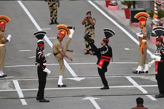 Pakistani Rangers (in black) and Indian Border Security Force (BSF) soldiers take part in the "Beating the Retreat" ceremony on the eve of Pakistan"s Independence Day celebrations at the India-Pakistan Wagah border post, about 30km from Amritsar, Punjab on August 13, 2023.