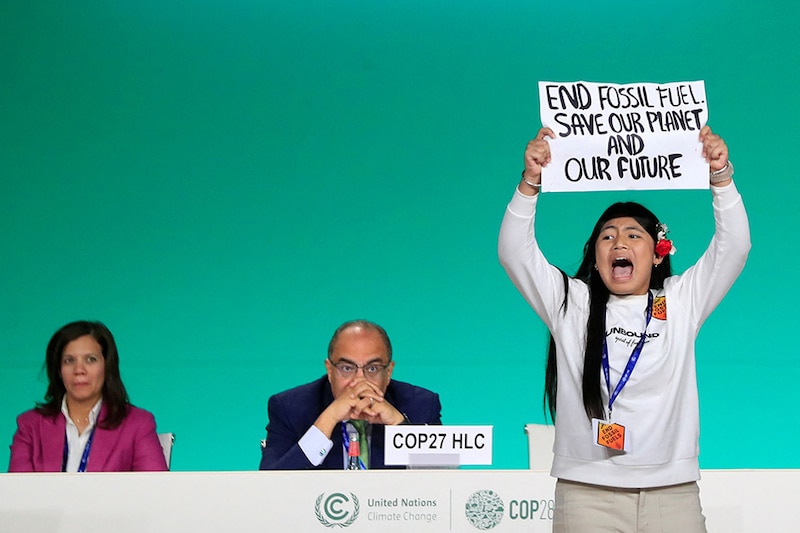 Licypriya Kangujam, an Indigenous climate activist from India, holds a banner during the United Nations Climate Change Conference (COP28) in Dubai, United Arab Emirates, December 11, 2023.
