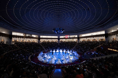 Whirling dervishes perform a sipiritual Dhikr "Devran-i Serif" ritual during a ceremony, one of many marking the 750th anniversary of the death of Mevlana Jalaluddin Rumi, the father of Sufism who lived in the 13th century, at Mevlana Cultural Center in Konya, on December 16, 2023.
Image: Ozan Kose / AFP© Whirling dervishes perform a sipiritual Dhikr "Devran-i Serif" ritual during a ceremony, one of many marking the 750th anniversary of the death of Mevlana Jalaluddin Rumi, the father of Sufism who lived in the 13th century, at Mevlana Cultural Center in Konya, on December 16, 2023.
Image: Ozan Kose / AFP©