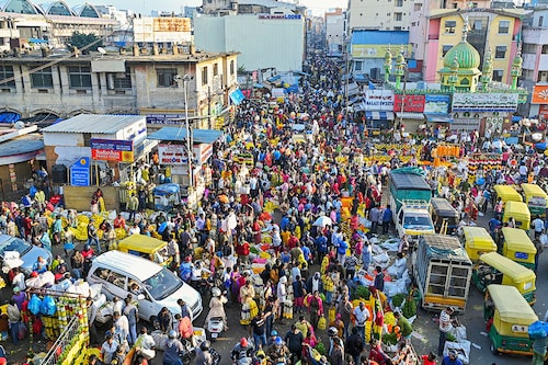 People crowd at a market in Bangalore, India.
Manjunath KIRAN / AFP People crowd at a market in Bangalore, India.
Manjunath KIRAN / AFP