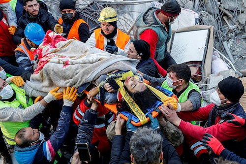 Rescuers carry 27-year-old survivor Rabia Ofkeli in the aftermath of a deadly earthquake in Hatay, Turkey February 10, 2023.
Image: Kemal Aslan/ Reuters Rescuers carry 27-year-old survivor Rabia Ofkeli in the aftermath of a deadly earthquake in Hatay, Turkey February 10, 2023.
Image: Kemal Aslan/ Reuters
