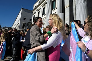 Spain"s Minister for Equality Irene Montero (L) celebrates with LGBTI+ member Niurka Gibaja in front of the Spanish Congress, in Madrid. Image: Oscar Del Pozo/AFP