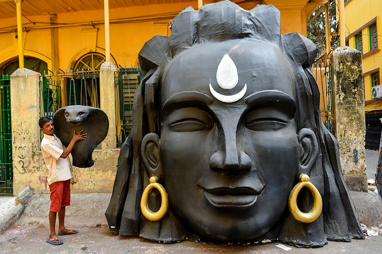 The head of Lord Shiva and his snake are seen at a artisan workshop, made as a decoration purpose on the occasion of Maha Shivratri in Kolkata, India, on February 17, 2023. Maha Shivaratri is a Hindu festival celebrated annually in honor of the deity Shiva. The name also refers to the night when Shiva is regarded to perform his divine dance, called the Tandava.
