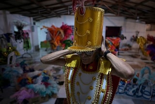 A member of the School of Samba Unidos de Capim Branco (ESUCAB) wears a refurbished carnival costume in Capim Branco, state of Minas Gerais, Brazil, on February 15, 2023.
Image: Douglas Magno/ AFPÂ©