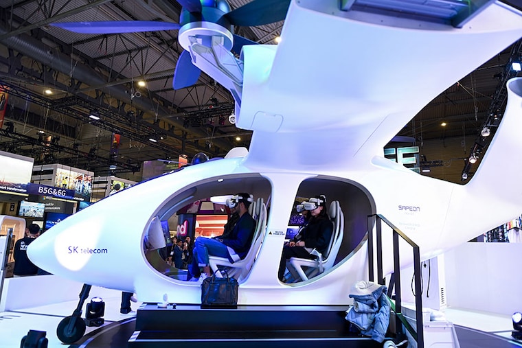 Visitors attend a demonstration of the urban UAM aircraft taxi by South Korean company SK Telecom at the Mobile World Congress (MWC), the telecom industry"s biggest annual gathering, in Barcelona on February 27, 2023.