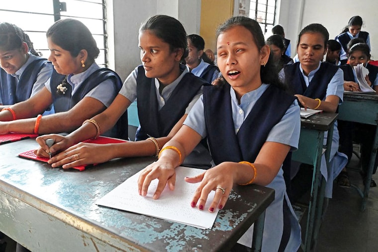 Visually impaired students read and write using the Braille system in their classroom at the Sri Sai Junior College for visually challenged, in Hyderabad, on January 4, 2023. Today is the 214th birth anniversary of Louis Braille, the inventor of the Braille system, a tactile writing system, used by the visually impaired to read and write.