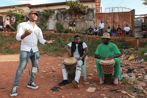 A group of young MbolÃ© artists gather in a stadium during an improvisation session in the Mvog-Ada district in Yaounde.
Image: Daniel Beloumou Olomi / AFP