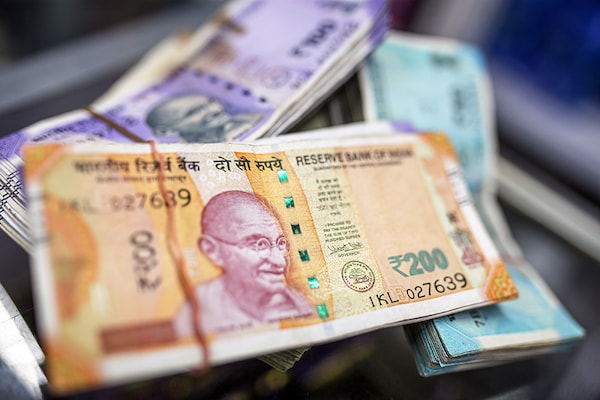 The rupee fell 12 paisa, its weakest since June 8, as talk of a US rate hike gathered pace.
Image: Dhiraj Singh/Bloomberg via Getty Images